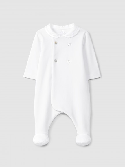 Mono de beb� en terciopelo canelado con botones decorativos y detalle en punto de cruz