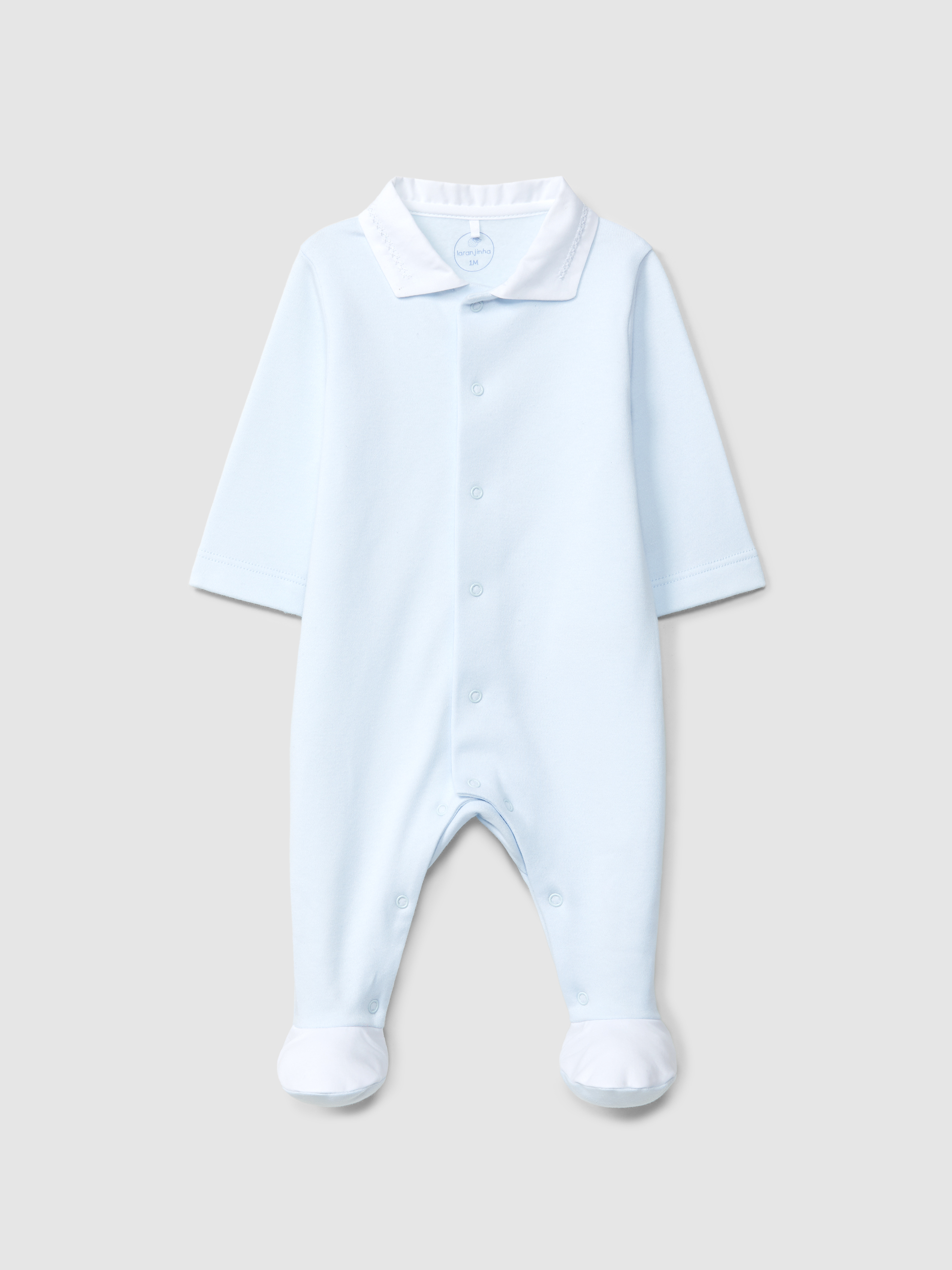 Babygrow à col en V et détail en point de croix