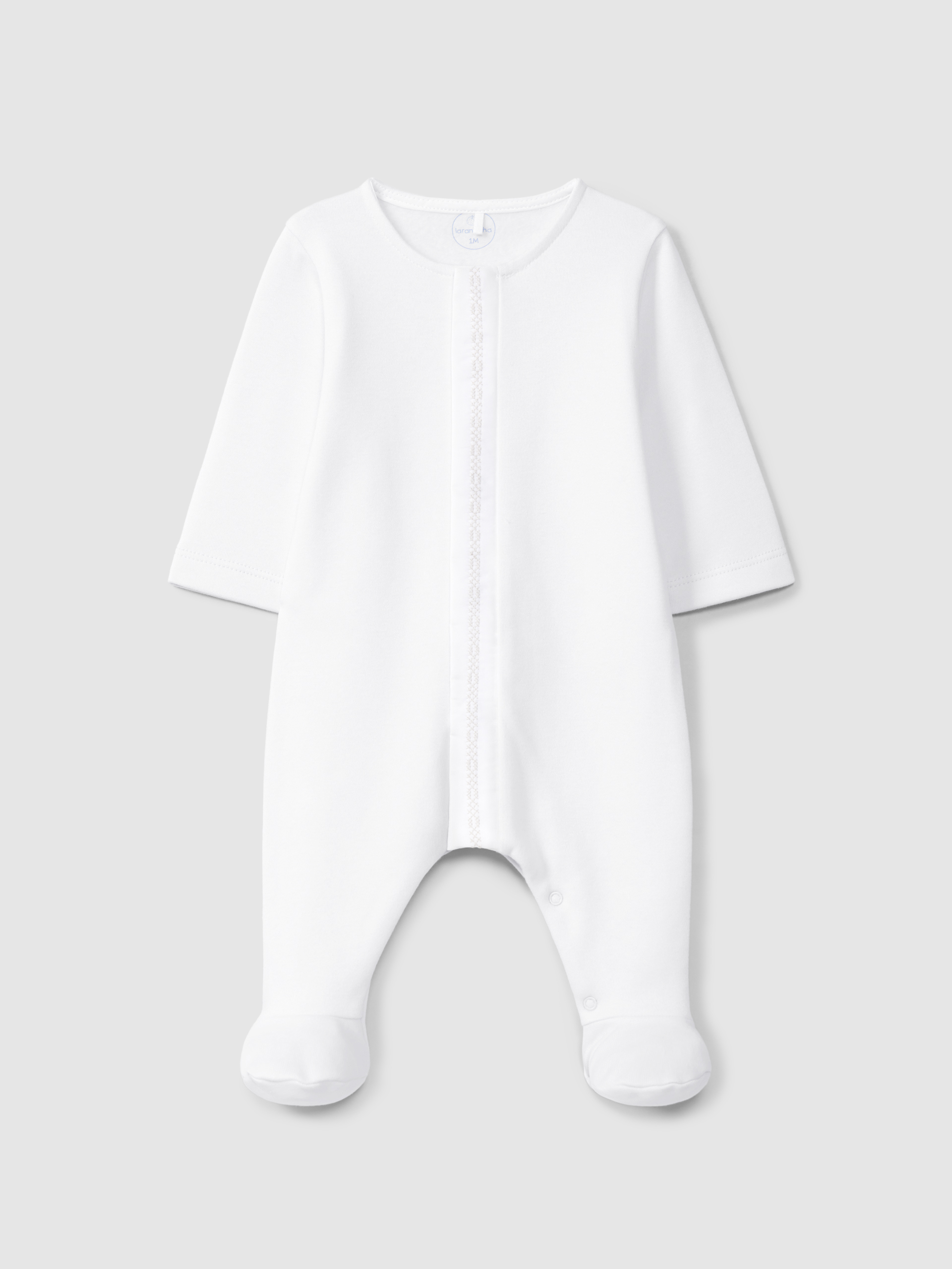Babygrow with cross stitch embroidery detail