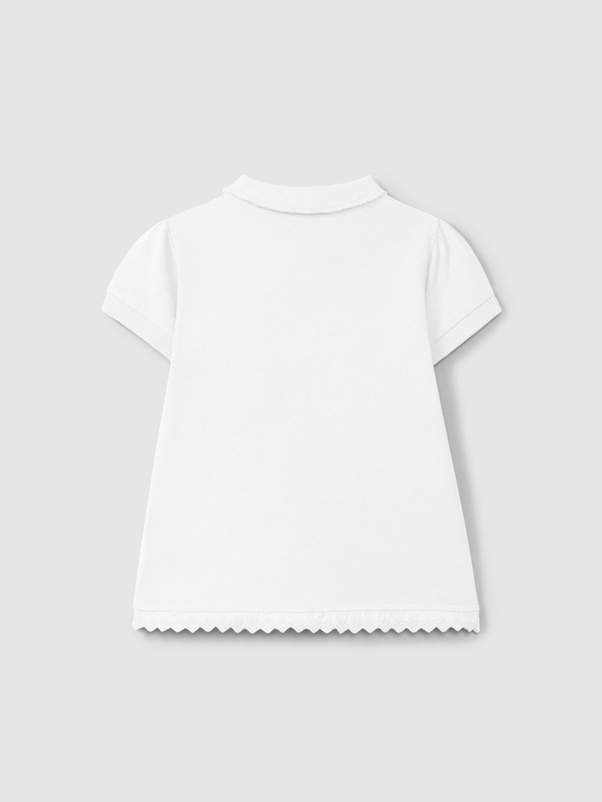 Robe en maille unie avec détails brodés