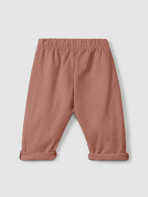 Pantalon pull-up en maille unie avec détails brodés Pantalon pull-up en maille unie avec détails brodés