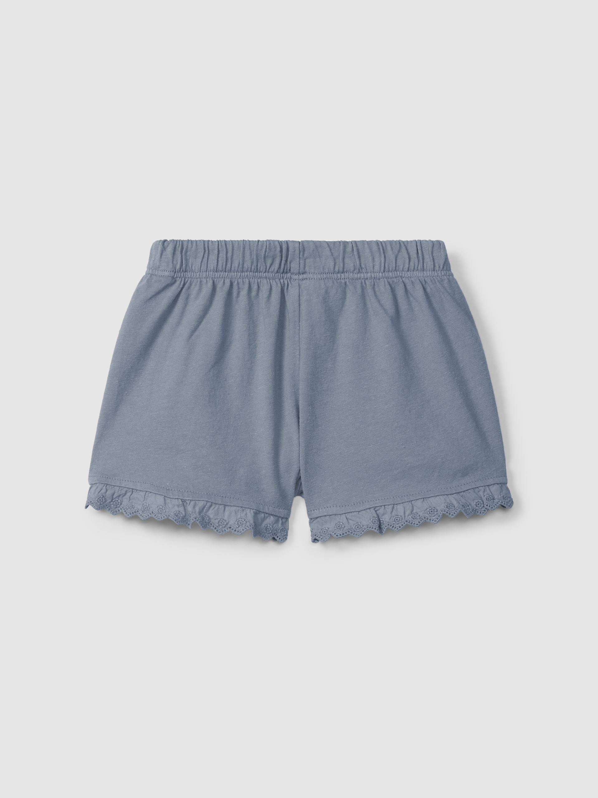 Pantalón corto en punto liso con detalles bordados