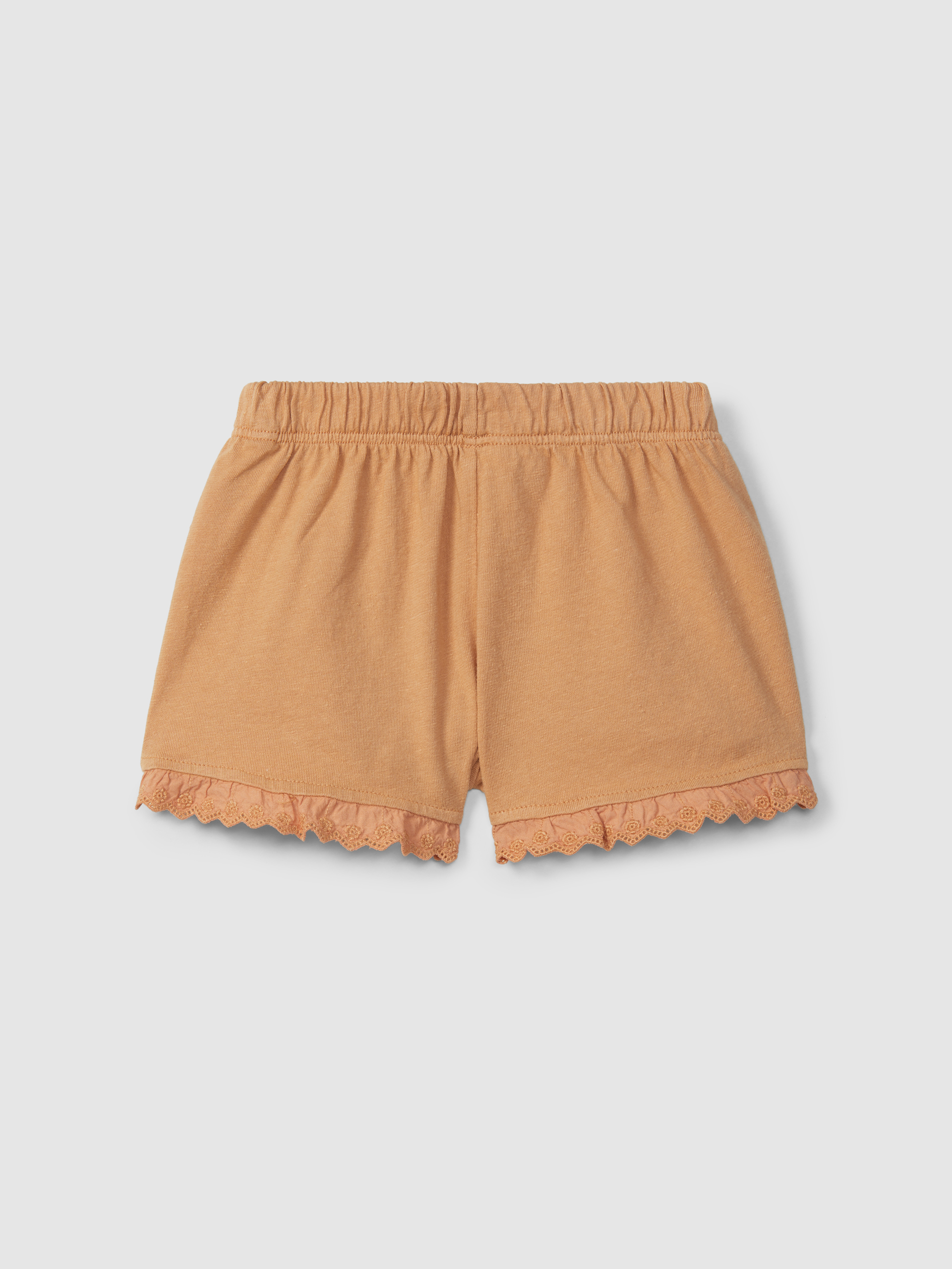 Calções pull-up em malha lisa com detalhes bordados