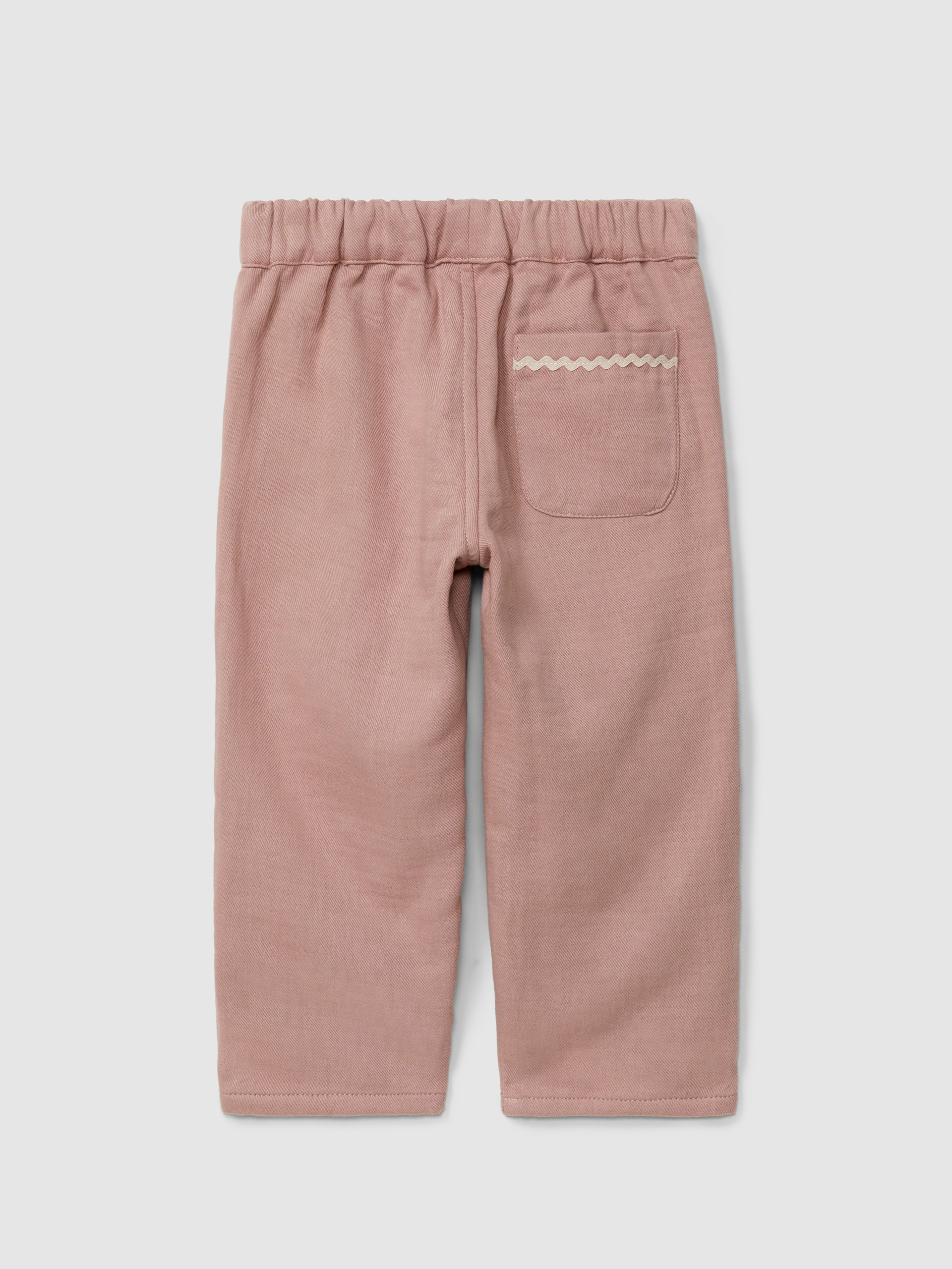 Pantalón pull-up con detalle bordado y picunela