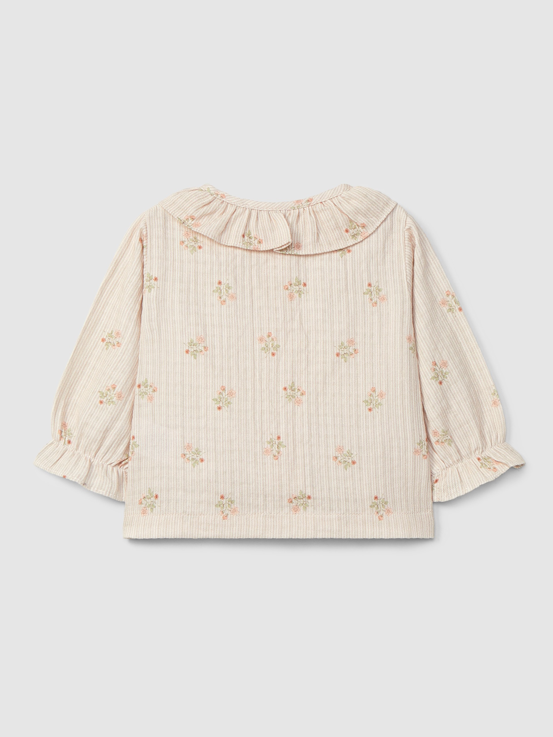 Blusa de flores con cuello de volante
