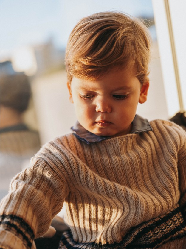 Knitted jumper with striped hem Knitted jumper with striped hem