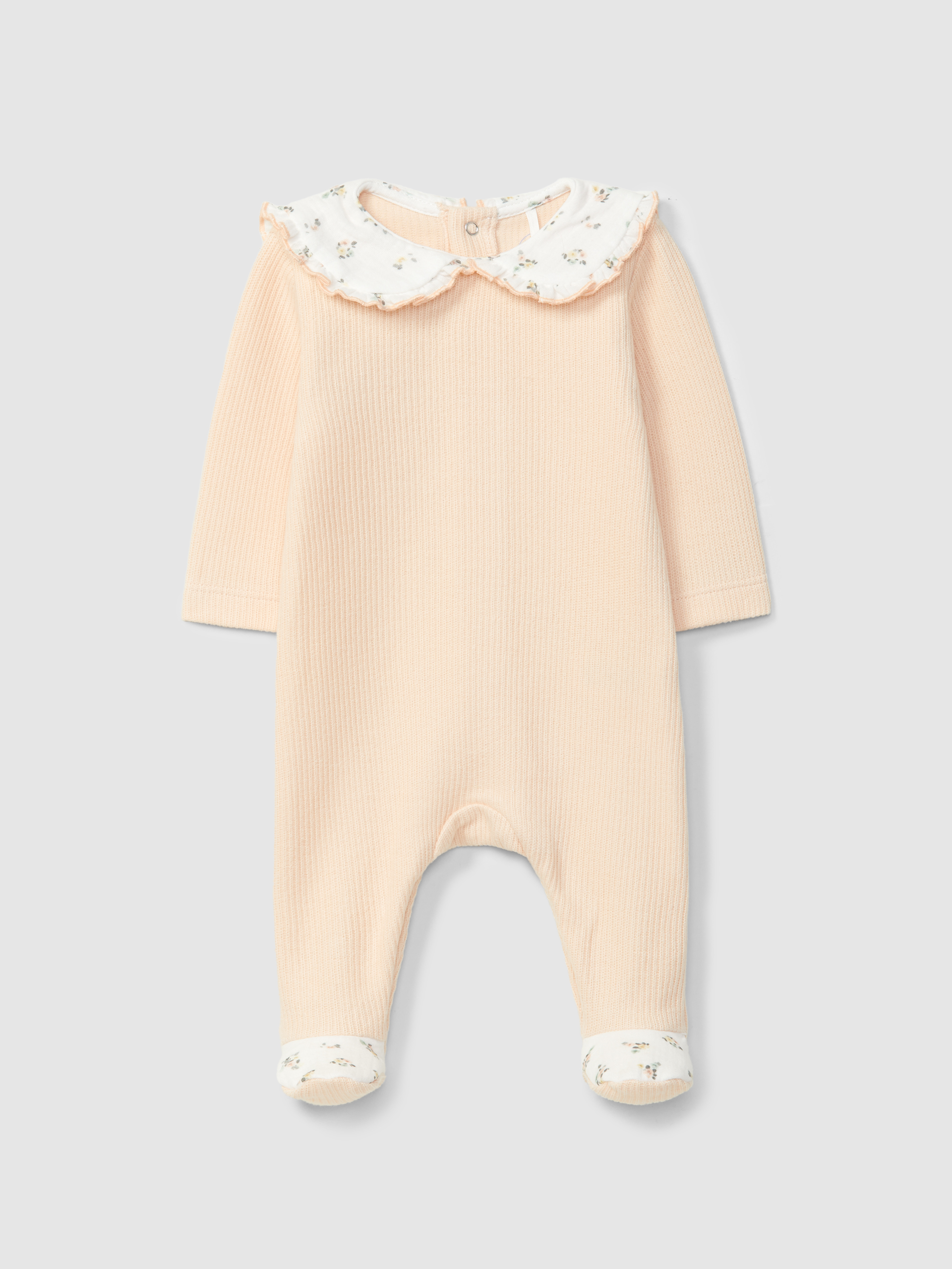 Mono de bebé en algodón orgánico con cuello de volante con estampado floral