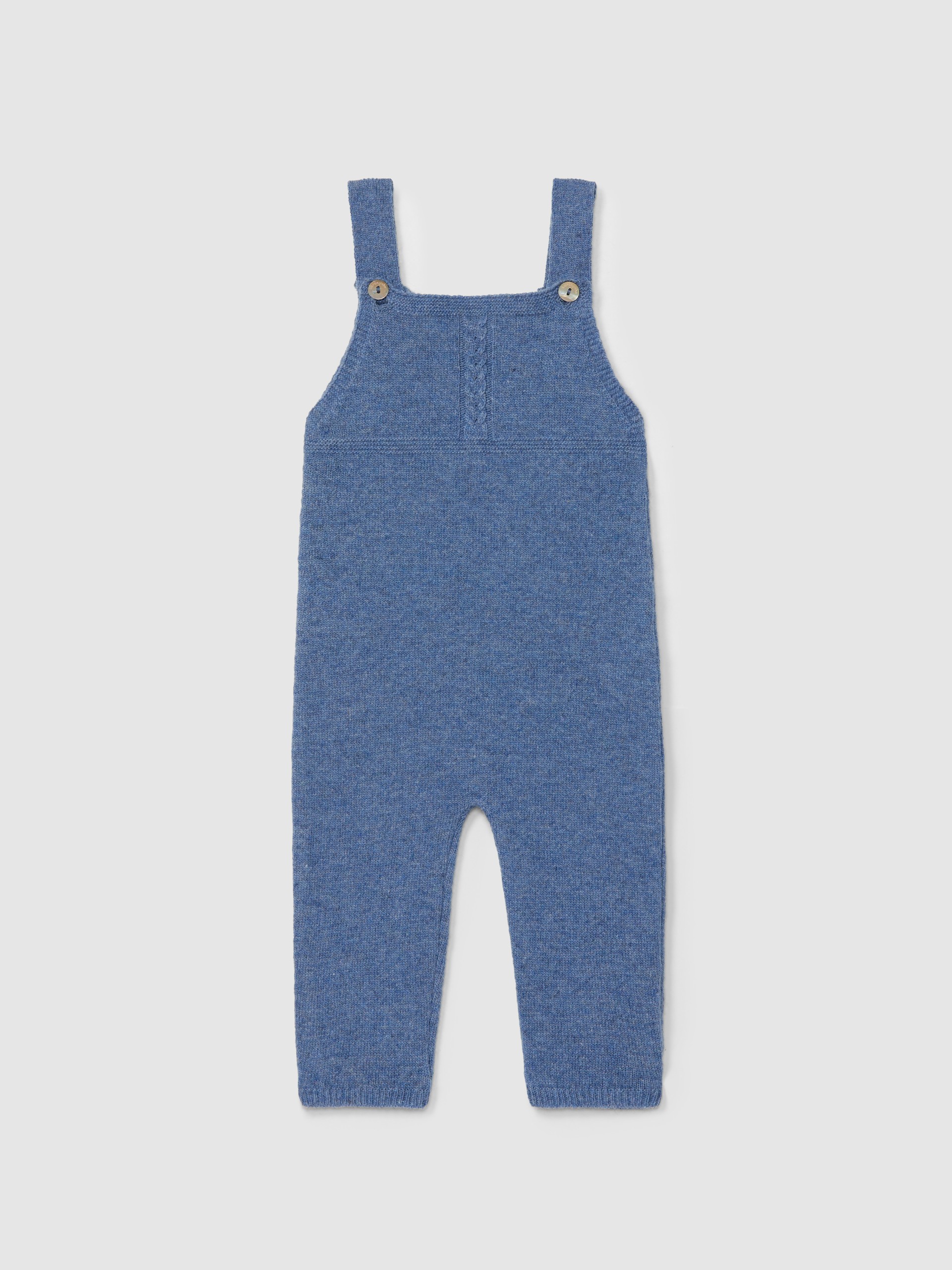 Dungarees knitted in wool with cable-knit detail