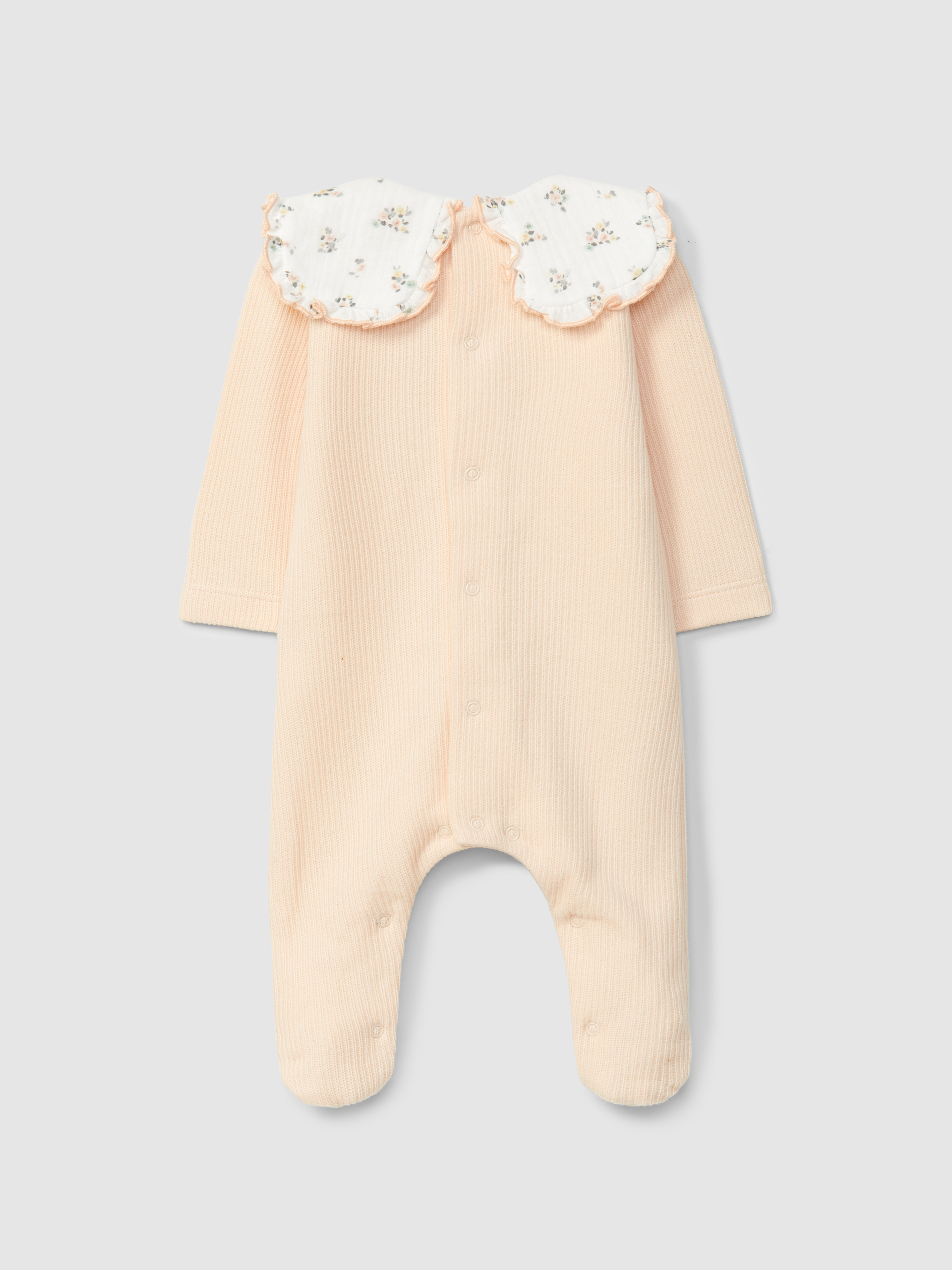 Mono de bebé en algodón orgánico con cuello de volante con estampado floral