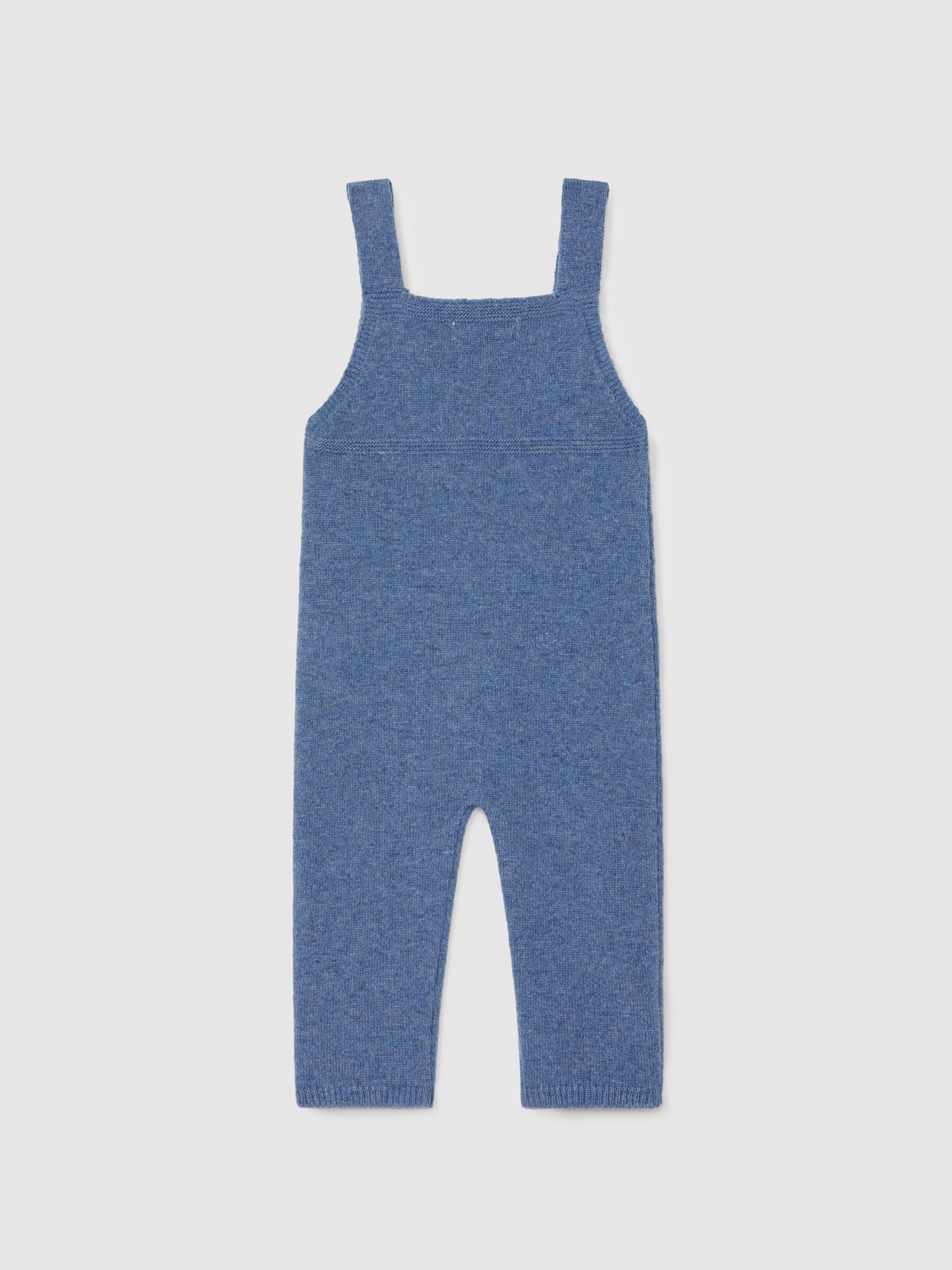 Dungarees knitted in wool with cable-knit detail
