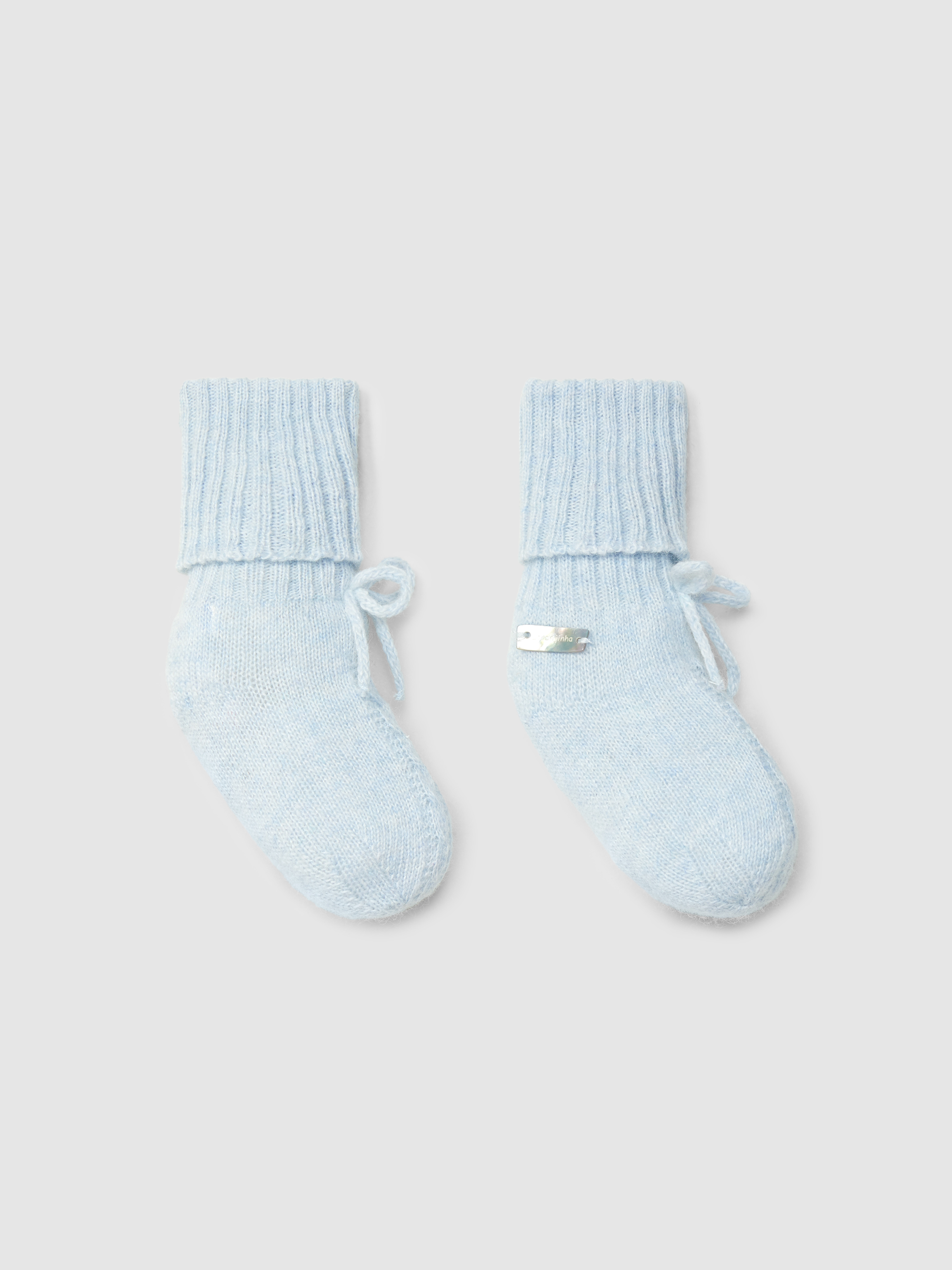 Knitted booties with cable-knit detail