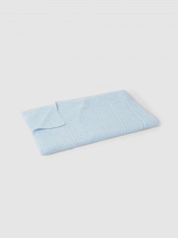 Knitted blanket with cable-knit detail