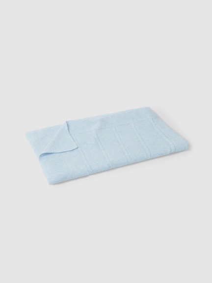 Knitted blanket with cable-knit detail